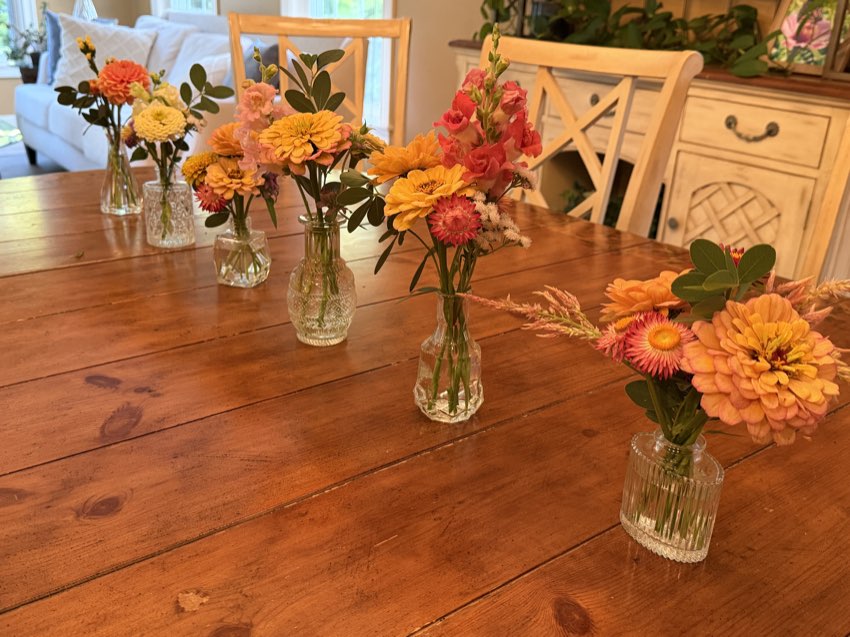 Bud vases down the middle of a long table